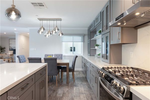 Dining room, Interior, Kitchen, Marble Walls, Pendant Lights, Recessed Lighting, Stainless Steel Appliances, Wood Texture Flooring