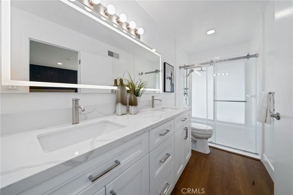 Bathroom, Dual Sink Vanities, Glass Shower, Interior, Recessed Lighting, Wood Texture Flooring