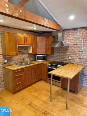 Interior, Kitchen, Recessed Lighting, Stainless Steel Appliances, Stone Walls, Wood Texture Flooring