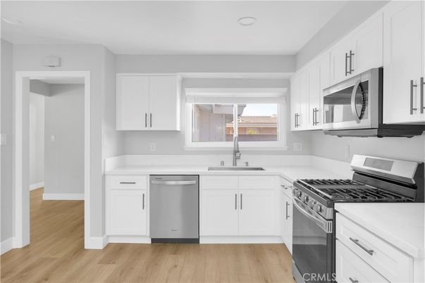 Interior, Kitchen, Recessed Lighting, Stainless Steel Appliances, Wood Texture Flooring
