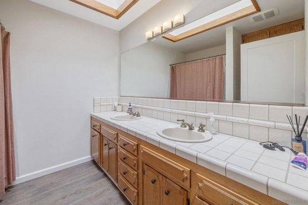 Bathroom, Dual Sink Vanities, Interior, Tile Countertops, Wood Texture Flooring