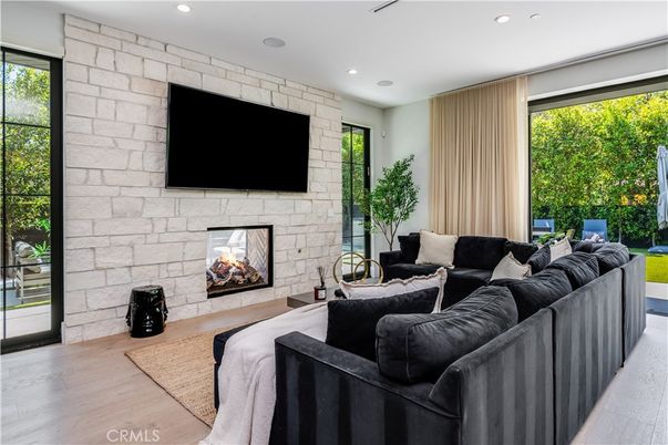 Fireplace, Interior, Living room, Recessed Lighting, Stone Walls, Wood Texture Flooring