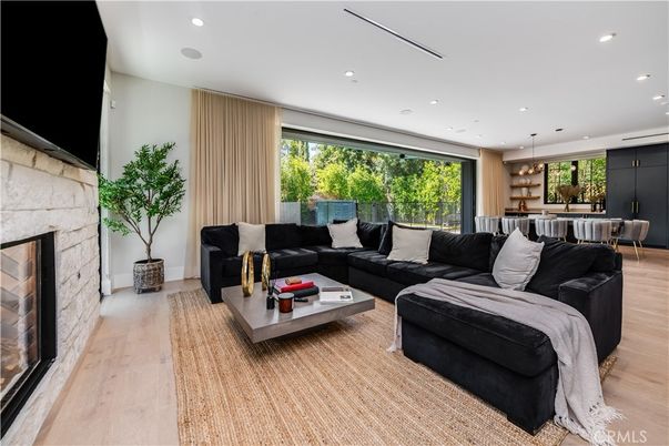Dining room, Fireplace, Interior, Living room, Pendant Lights, Recessed Lighting, Wood Texture Flooring