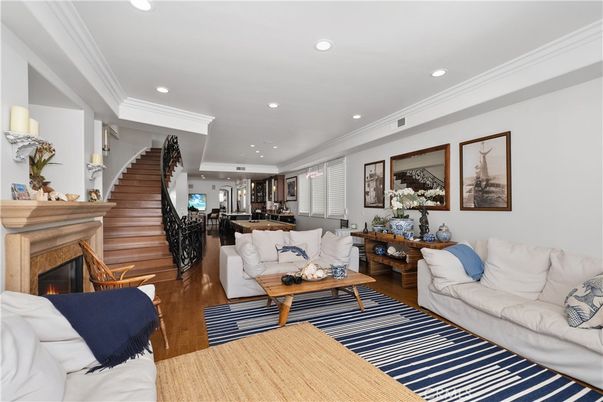 Dining room, Fireplace, Interior, Living room, Recessed Lighting, Wood Texture Flooring
