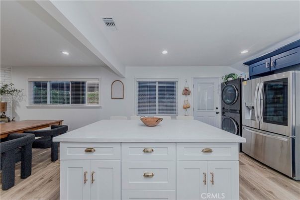 Interior, Kitchen, Recessed Lighting, Washer, Wood Texture Flooring