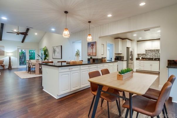 Dining room, Interior, Kitchen, Pendant Lights, Recessed Lighting, Stainless Steel Appliances, Wood Texture Flooring