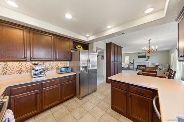 Chandelier, Dining room, Fireplace, Interior, Kitchen, Recessed Lighting, Stainless Steel Appliances