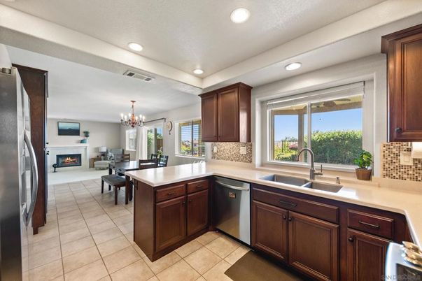 Chandelier, Dining room, Fireplace, Interior, Kitchen, Recessed Lighting, Stainless Steel Appliances