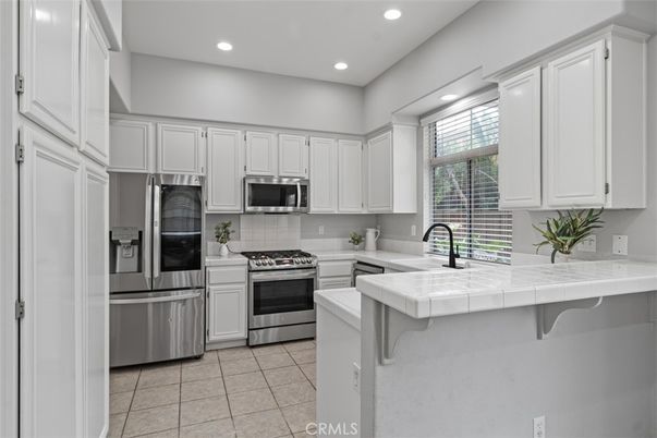 Interior, Kitchen, Recessed Lighting, Stainless Steel Appliances, Tile Countertops