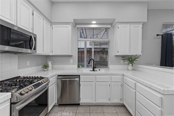 Interior, Kitchen, Recessed Lighting, Stainless Steel Appliances, Tile Countertops