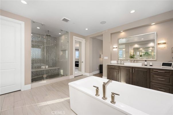 Bathroom, Dual Sink Vanities, Free Standing Baths, Glass Shower, Interior, Recessed Lighting, Wood Texture Flooring