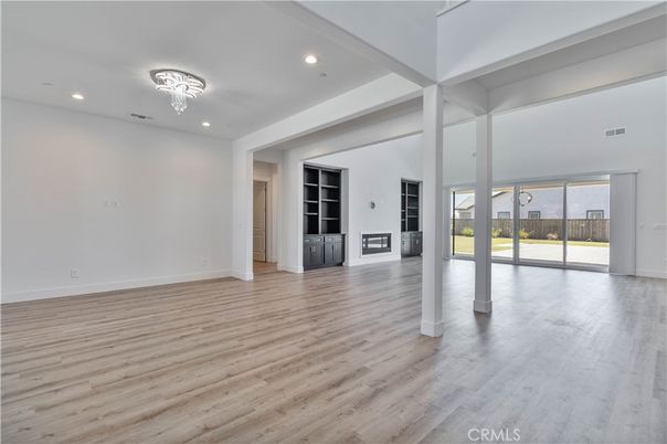 Chandelier, Empty room, Fireplace, Interior, Recessed Lighting, Wood Texture Flooring
