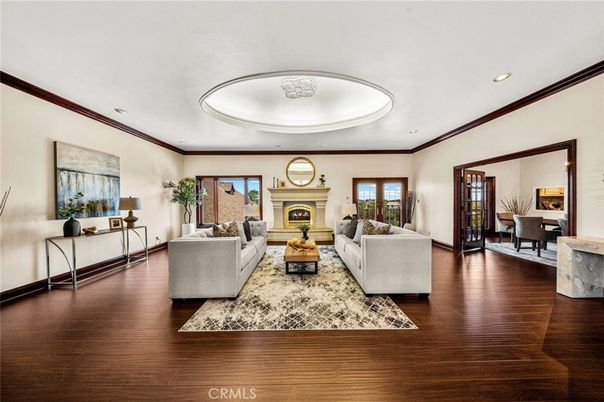 Dining room, Fireplace, Interior, Living room, Recessed Lighting, Wood Texture Flooring