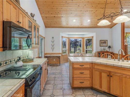 Dining room, Interior, Kitchen, Pendant Lights, Recessed Lighting, Tile Countertops, Wooden Ceilings