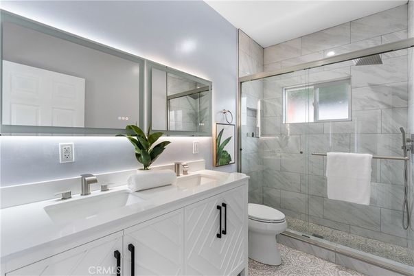 Bathroom, Dual Sink Vanities, Glass Shower, Interior, Marble Walls, Recessed Lighting