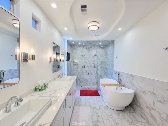 Bathroom, Dual Sink Vanities, Free Standing Baths, Glass Shower, Interior, Marble, Marble Walls, Recessed Lighting