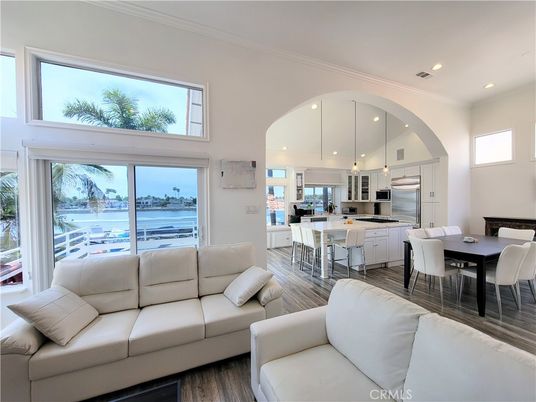 Dining room, Interior, Kitchen, Living room, Recessed Lighting, Stainless Steel Appliances, Water, Wood Texture Flooring
