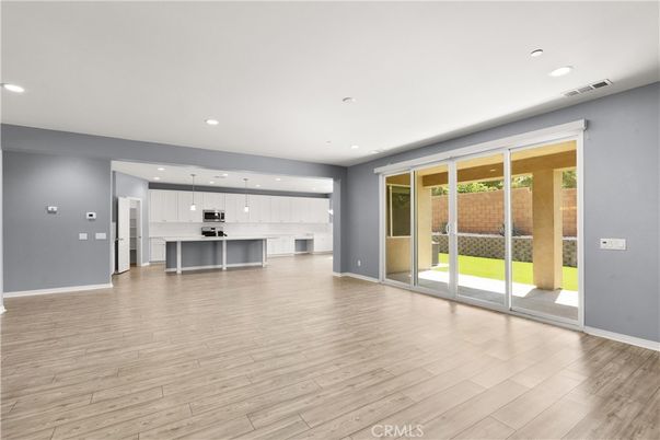 Empty room, Interior, Kitchen, Pendant Lights, Recessed Lighting, Stainless Steel Appliances, Wood Texture Flooring
