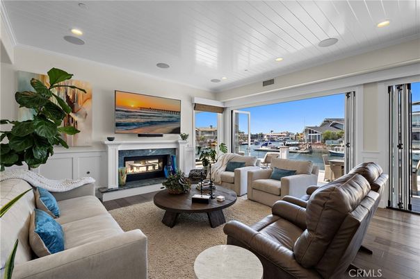 Fireplace, Interior, Living room, Recessed Lighting, Water, Wood Texture Flooring