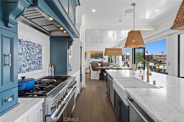 Chandelier, Dining room, Interior, Kitchen, Pendant Lights, Recessed Lighting, Stainless Steel Appliances, Wood Texture Flooring