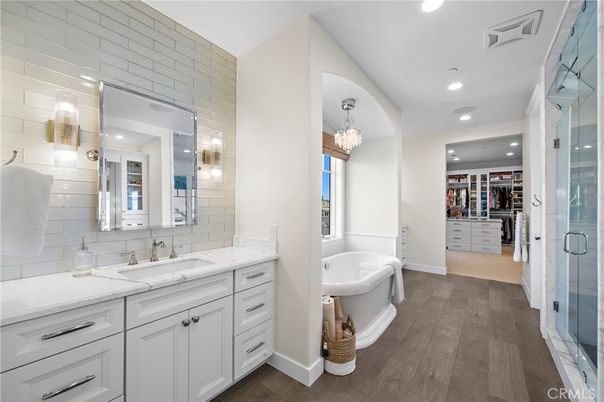 Bathroom, Chandelier, Dual Sink Vanities, Free Standing Baths, Interior, Recessed Lighting, Walk-in Closets, Wood Texture Flooring