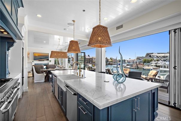 Dining room, Interior, Kitchen, Pendant Lights, Recessed Lighting, Stainless Steel Appliances, Water, Wood Texture Flooring