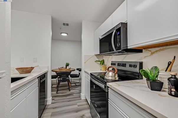 Dining room, Interior, Kitchen, Recessed Lighting, Stainless Steel Appliances, Wood Texture Flooring