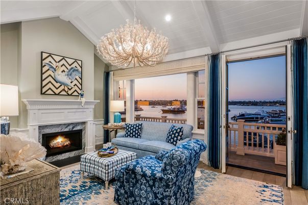 Chandelier, Fireplace, Interior, Living room, Recessed Lighting, Water, Wood Texture Flooring