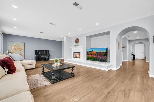 Fireplace, Interior, Living room, Piano, Recessed Lighting, Wood Texture Flooring