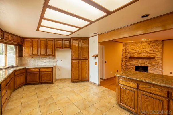 Fireplace, Interior, Kitchen, Recessed Lighting, Stone Walls, Wood Texture Flooring