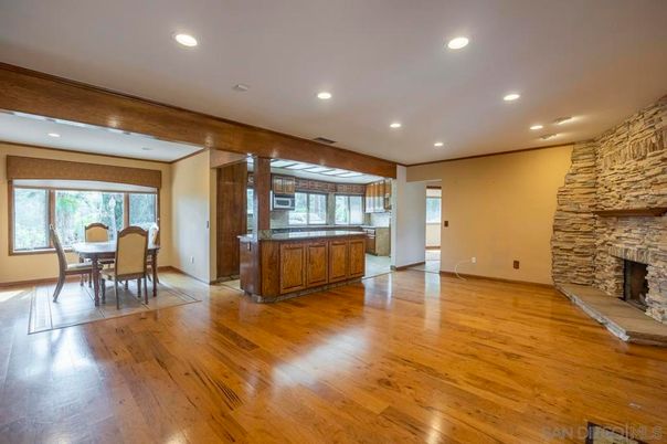 Dining room, Fireplace, Interior, Kitchen, Recessed Lighting, Stone Walls, Wood Texture Flooring