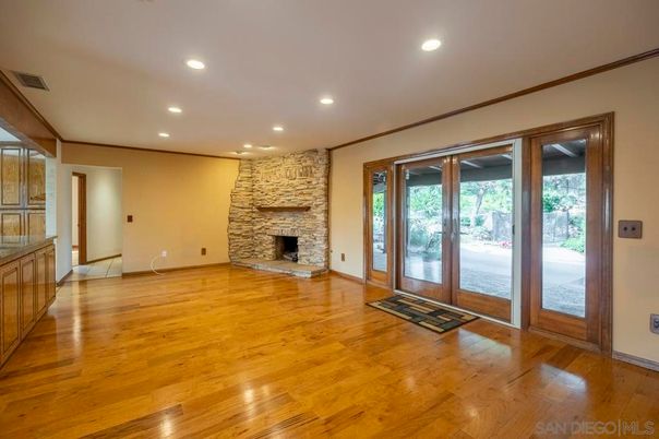 Empty room, Fireplace, Interior, Recessed Lighting, Stone Walls, Wood Texture Flooring