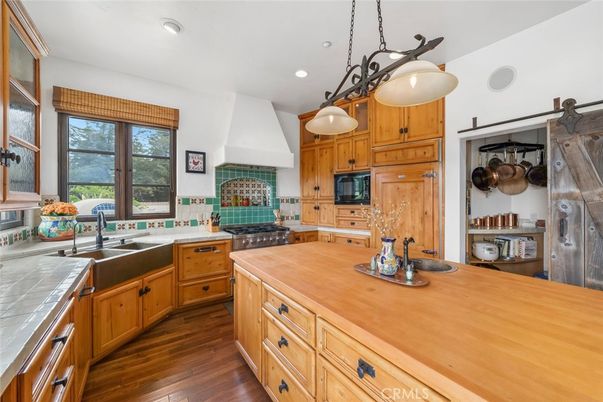 Interior, Kitchen, Pendant Lights, Recessed Lighting, Tile Countertops, Wood Texture Flooring