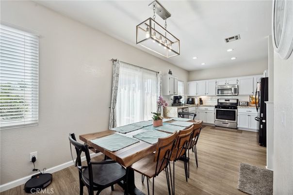 Dining room, Interior, Kitchen, Pendant Lights, Recessed Lighting, Stainless Steel Appliances, Wood Texture Flooring