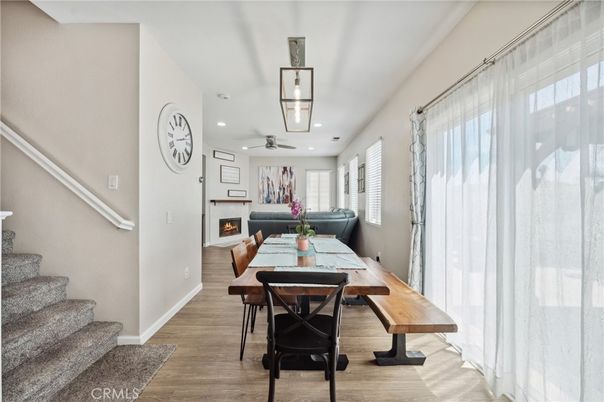 Dining room, Fireplace, Interior, Living room, Recessed Lighting, Wood Texture Flooring