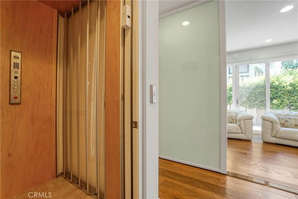 Elevator, Interior, Recessed Lighting, Wood Texture Flooring, Wooden Walls