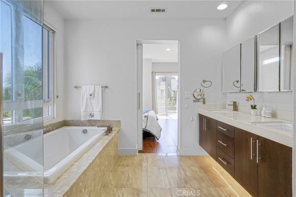 Bathroom, Dual Sink Vanities, Glass Shower, Interior, Recessed Lighting, Wood Texture Flooring