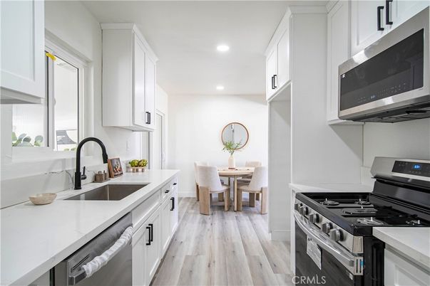 Dining room, Interior, Kitchen, Recessed Lighting, Stainless Steel Appliances, Wood Texture Flooring