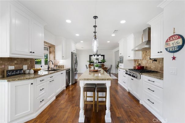 Dining room, Interior, Kitchen, Pendant Lights, Recessed Lighting, Stainless Steel Appliances, Wood Texture Flooring