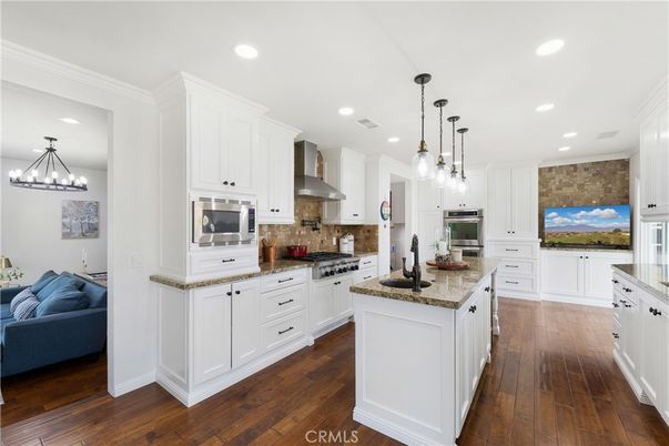 Chandelier, Interior, Kitchen, Pendant Lights, Recessed Lighting, Stainless Steel Appliances, Wood Texture Flooring