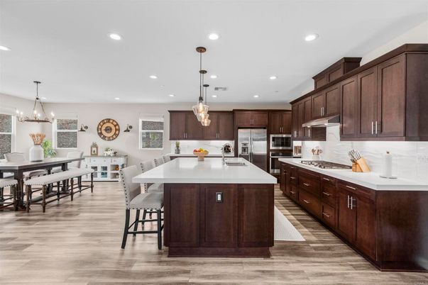 Dining room, Interior, Kitchen, Pendant Lights, Recessed Lighting, Stainless Steel Appliances, Wood Texture Flooring