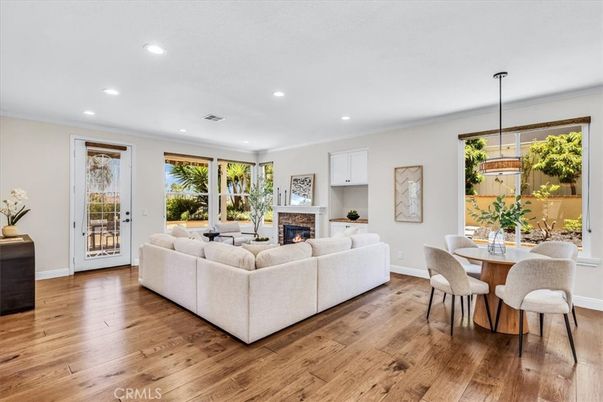 Dining room, Fireplace, Interior, Living room, Recessed Lighting, Wood Texture Flooring
