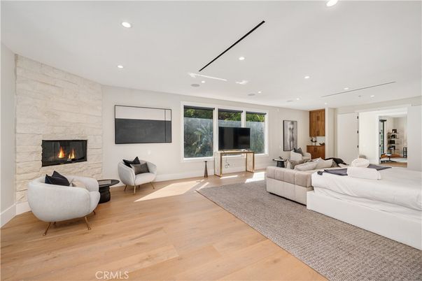 Fireplace, Interior, Living room, Recessed Lighting, Stone Walls, Wood Texture Flooring