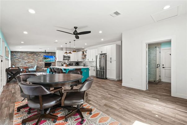 Dining room, Interior, Kitchen, Pendant Lights, Recessed Lighting, Stainless Steel Appliances, Stone Walls, Wood Texture Flooring