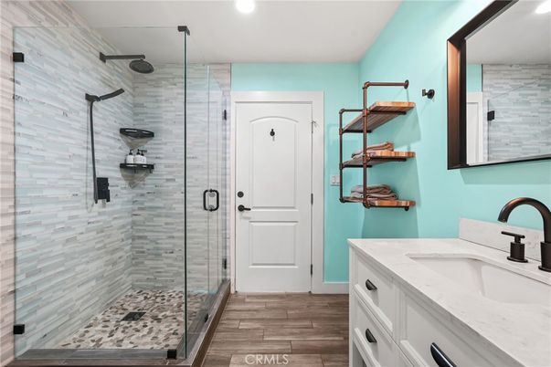 Bathroom, Dual Sink Vanities, Glass Shower, Interior, Recessed Lighting, Wood Texture Flooring