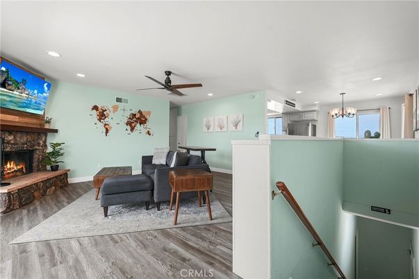 Chandelier, Fireplace, Interior, Piano, Recessed Lighting, Wood Texture Flooring