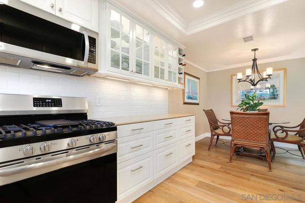 Chandelier, Dining room, Interior, Kitchen, Recessed Lighting, Stainless Steel Appliances, Wood Texture Flooring