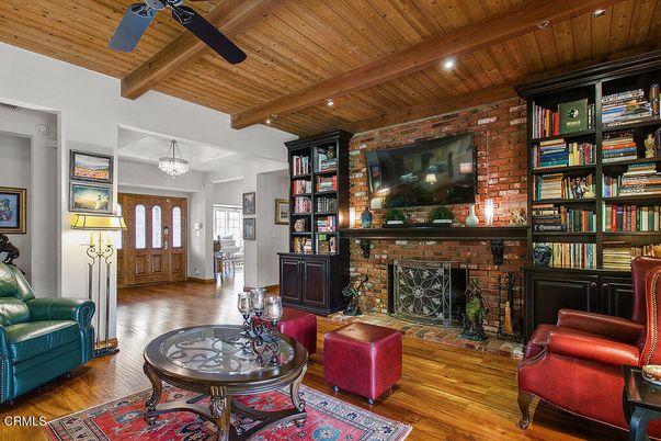 Chandelier, Fireplace, Interior, Living room, Recessed Lighting, Stone Walls, Wooden Beams, Wooden Ceilings, Wood Texture Flooring