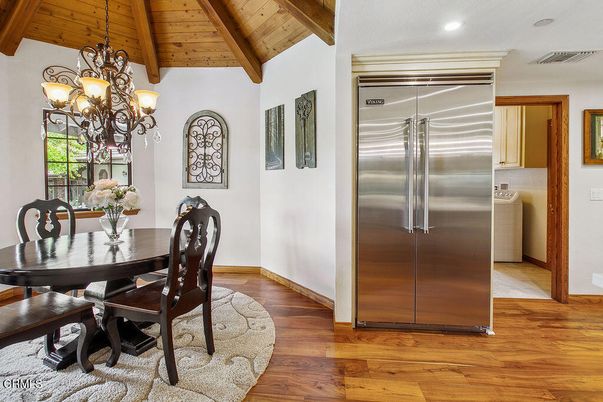 Chandelier, Dining room, Interior, Recessed Lighting, Stainless Steel Appliances, Wooden Beams, Wooden Ceilings, Wood Texture Flooring