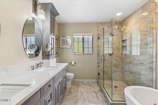Bathroom, Dual Sink Vanities, Glass Shower, Interior, Marble, Marble Walls, Recessed Lighting
